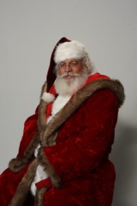 Naturally bearded Santa Howard seated - Have Santas Will Travel