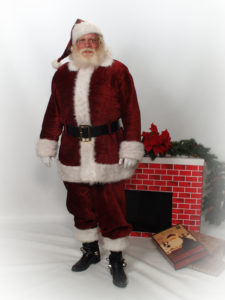 Santa Howard standing in front of fireplace - Have Santas Will Travel