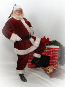 Naturally bearded Santa Howard in front of fireplace - Have Santas Will Travel